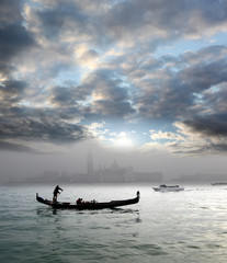 Alone Gondola in foggy morning, Venice, Italy