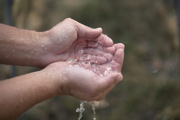 Trickling Water in Hands