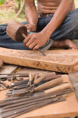 Traditional craftsman carving wood