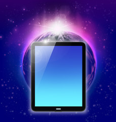 tablet pc on planet earth and sunrise background