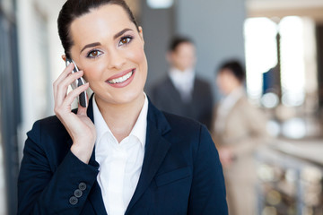 cute young businesswoman talking on cell phone