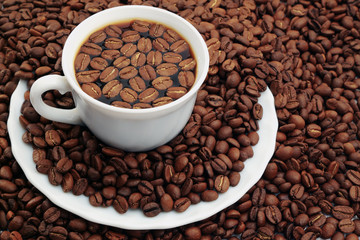 Cup of coffee with coffee beans