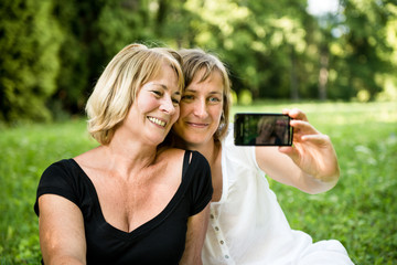 Senior mother with child taking picture