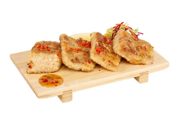 Fried fish fillets with  salad.