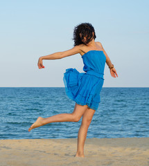 Woman posing on a sandy beach