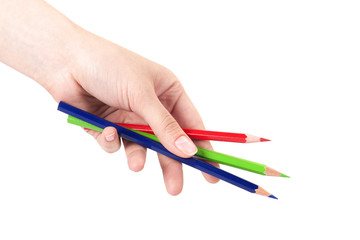 Hand holding color pencils isolated