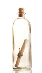 Glass bottle with note inside isolated on white