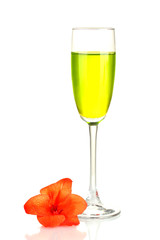 glass with cocktail and gladiolus bud isolated on white