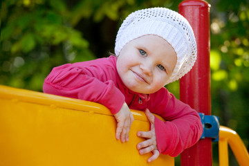 Little girl playing on the playground