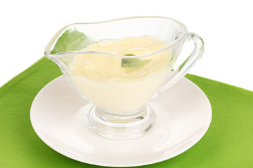 Mayonnaise in bowl on napkin isolated on white