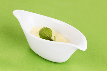 Mayonnaise in bowl on napkin isolated on white