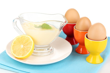 Mayonnaise in bowl on napkin isolated on white