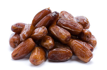 Dried dates over white background
