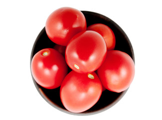 Red tomatoes on a plate, isolated background