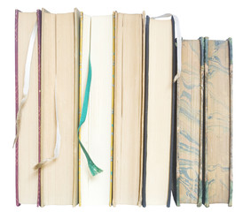 row of vintage books w. bookamarks, close up, isolated
