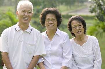 Three Senior Asian Smiling happily at park in a morning
