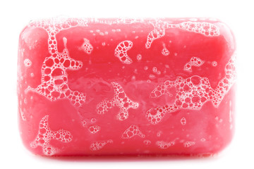 Wet bar of pink soap isolated on white background