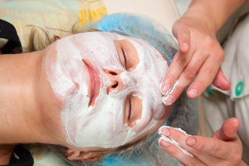 cosmetologist doing facial massage