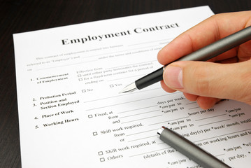 employment contract form with human hand