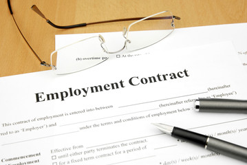 employment contract form on a desk