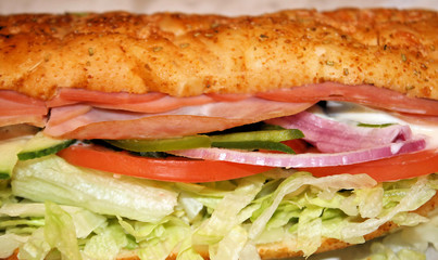 Sub Sandwich Stuffed With Assorted Cold Cuts and Veggies