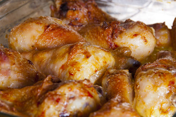 Chicken legs on a glass dish in the convection oven