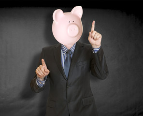 Businessman with a piggy bank head