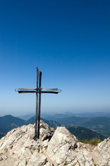 Metal cross on top of a mountain