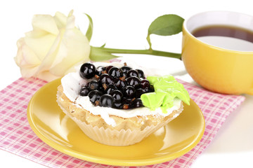 sweet cake with cup of tea isolated on white