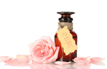 bottle of oil and rose isolated on white