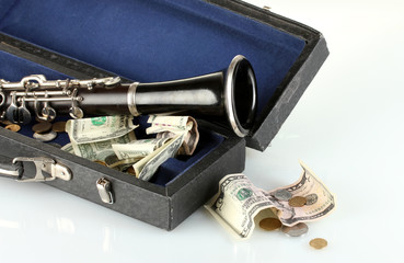 musical instrument with money isolated on white