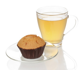 Fresh muffin with tea isolated on white