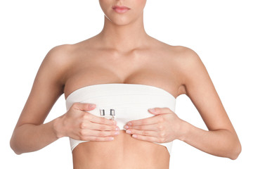 Amazing breast of a young woman, isolated, white background