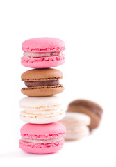 Stack of colorful macaroons on white background