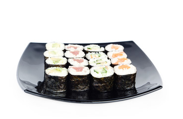 Black plate of sushi, isolated