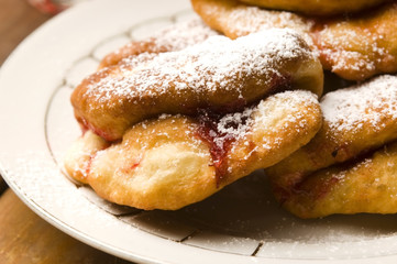 Dough with marmelade on wooden board