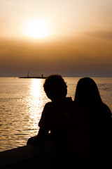 Young Couple Silhouette at Sunset