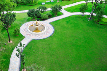 overlook panoramic of lawn with fountain.