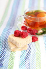 Tea with raspberries and mint