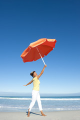 Joyful senior woman ocean background