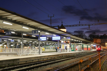 Fototapeta na wymiar Evening scene on a railway station