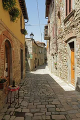 Printed roller blinds narrow stony street in tuscan borgo Montefioralle