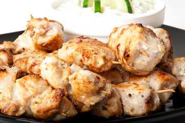 Delicious chicken skewers with cucumber cream sauce 