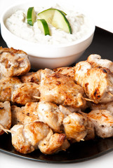 Delicious chicken skewers with cucumber cream sauce 