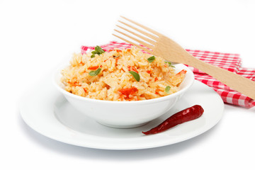 Rice in a bowl on a white background.