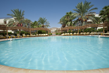 Fototapeta na wymiar Swimming pool in a tropical resort