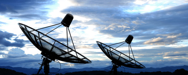 satellite dish antennas under blue sky