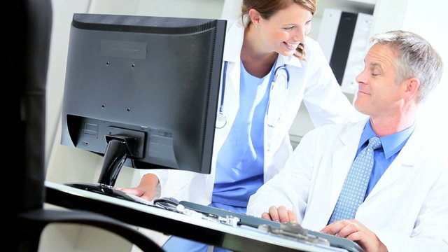 Medical Consultants Using Hospital Computer