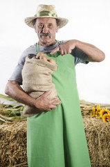 organic farmer with some freshly harvested potatoes