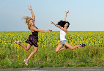 Two women leaping for joy